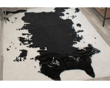 BLNK Barstow Collection Faux Cowhide Print Area Rug with Polyester Backing - Black, 5'W x 7'L