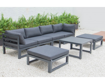 LeisureMod Chelsea 7-Piece Patio Ottoman Sectional and Coffee Table Set Black Aluminum with Cushions - Black