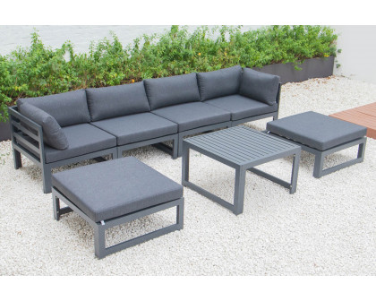 LeisureMod Chelsea 7-Piece Patio Ottoman Sectional and Coffee Table Set Black Aluminum with Cushions - Black