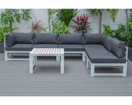 LeisureMod Chelsea 7-Piece Patio Sectional and Coffee Table Set In White Aluminum with Cushions - Black