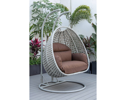 LeisureMod™ Mendoza Light Gray Wicker Hanging 2 Person Egg Swing Chair with Cushions - Brown