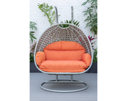 LeisureMod Mendoza Light Gray Wicker Hanging 2 Person Egg Swing Chair with Cushions - Orange