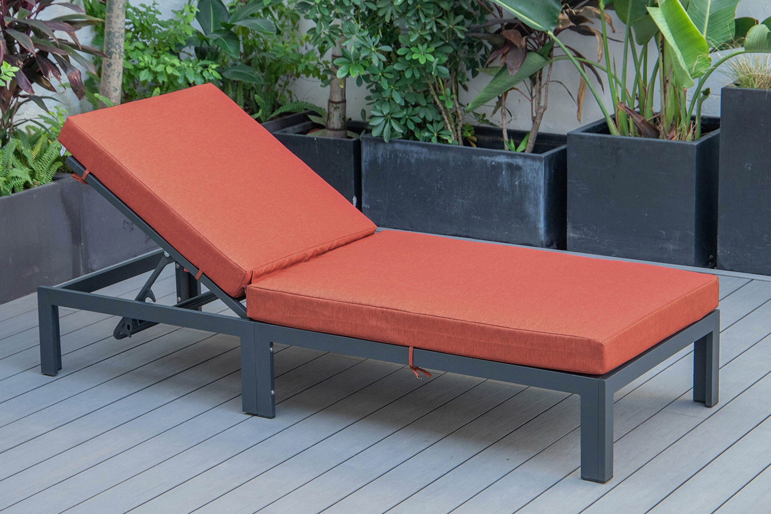 LeisureMod Chelsea Modern Outdoor Black Chaise Lounge Chair with Cushions - Orange