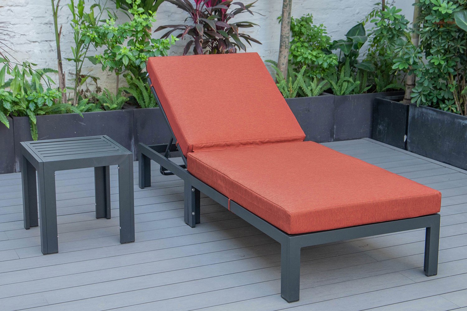 LeisureMod Chelsea Modern Outdoor Black Chaise Lounge Chair with Side Table and Cushions - Orange