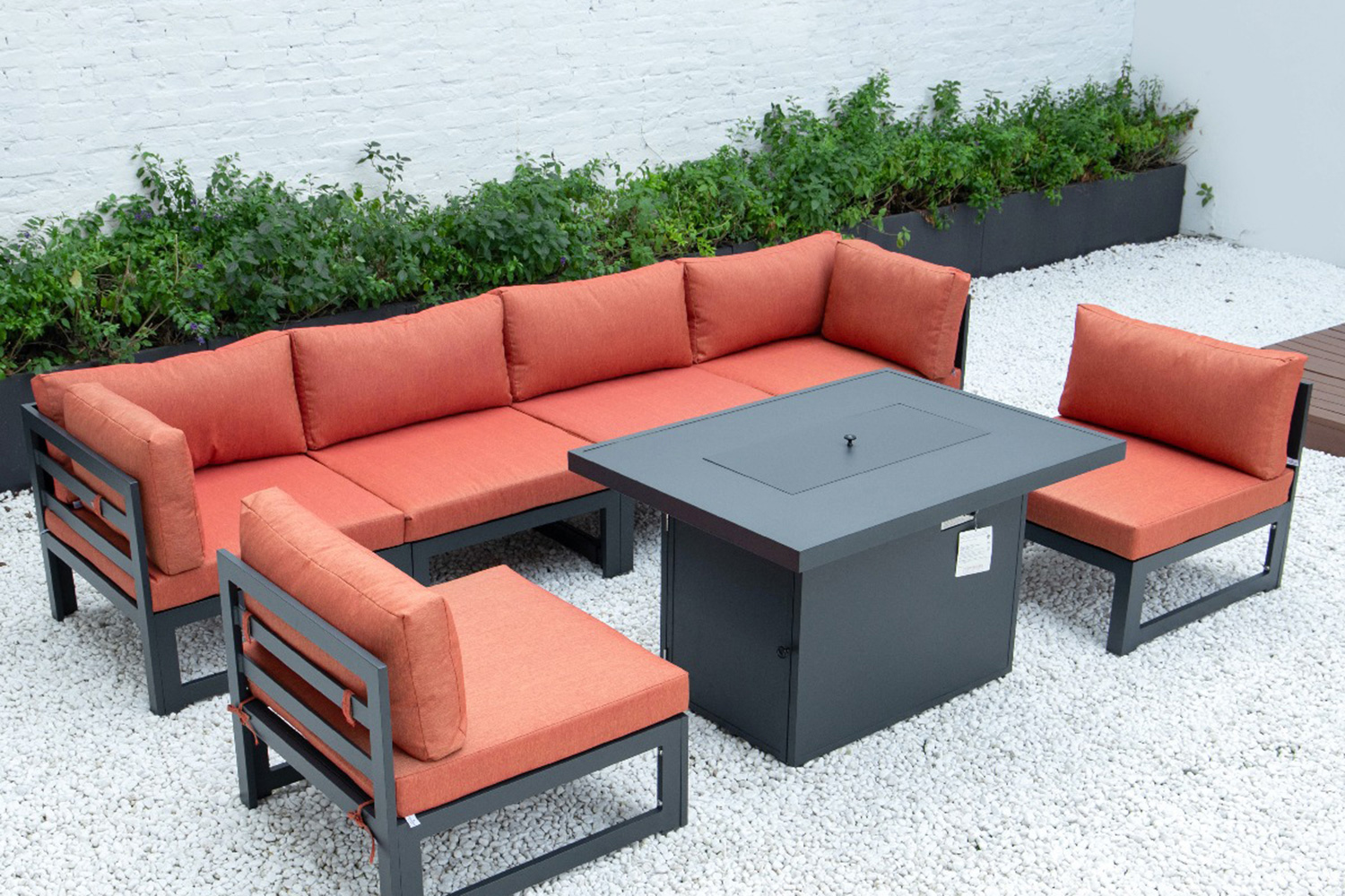 LeisureMod Chelsea 7-Piece Patio Sectional and Fire Pit Table Black Aluminum with Cushions - Orange