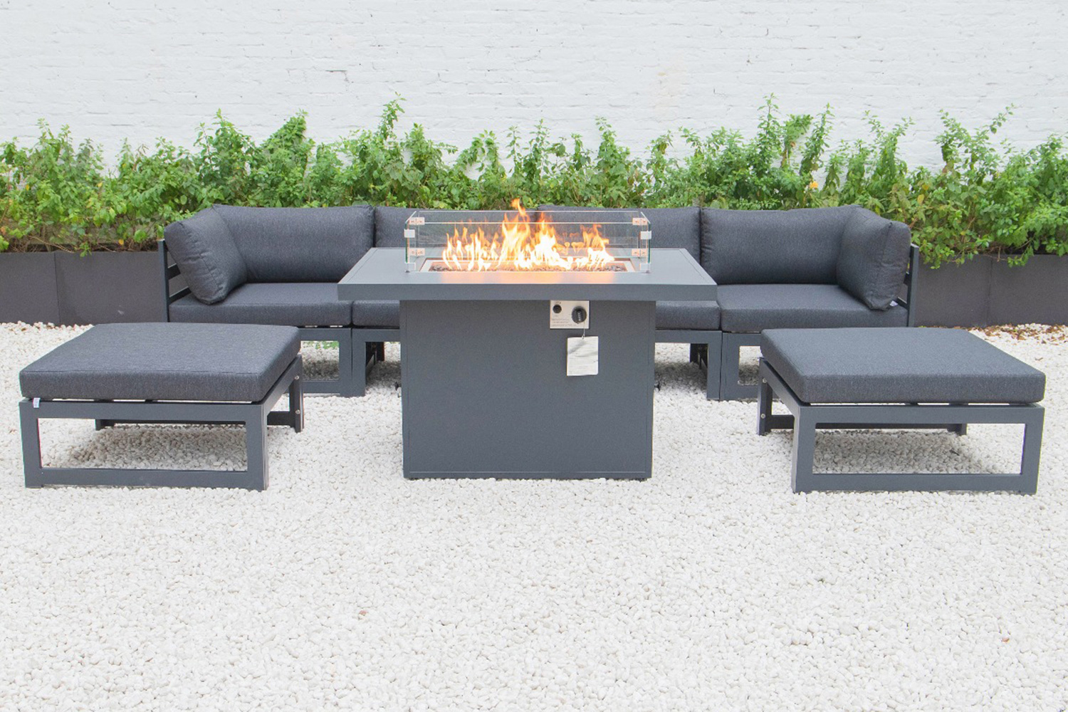 LeisureMod Chelsea 7-Piece Patio Ottoman Sectional and Fire Pit Table Black Aluminum with Cushions