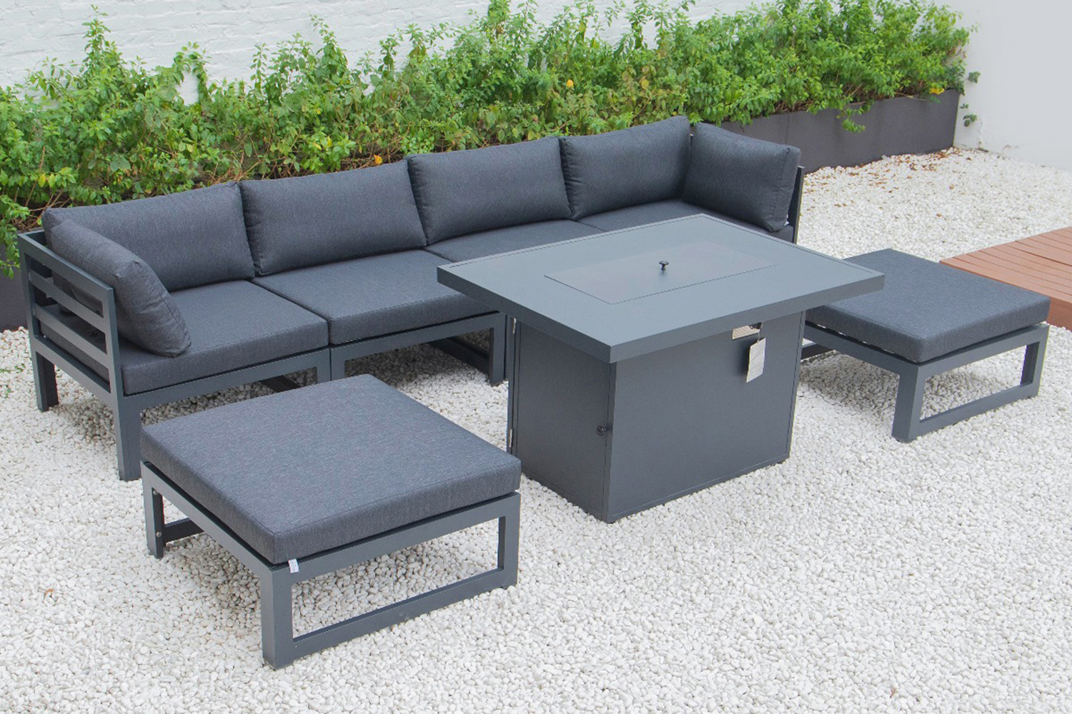 LeisureMod Chelsea 7-Piece Patio Ottoman Sectional and Fire Pit Table Black Aluminum with Cushions - Black