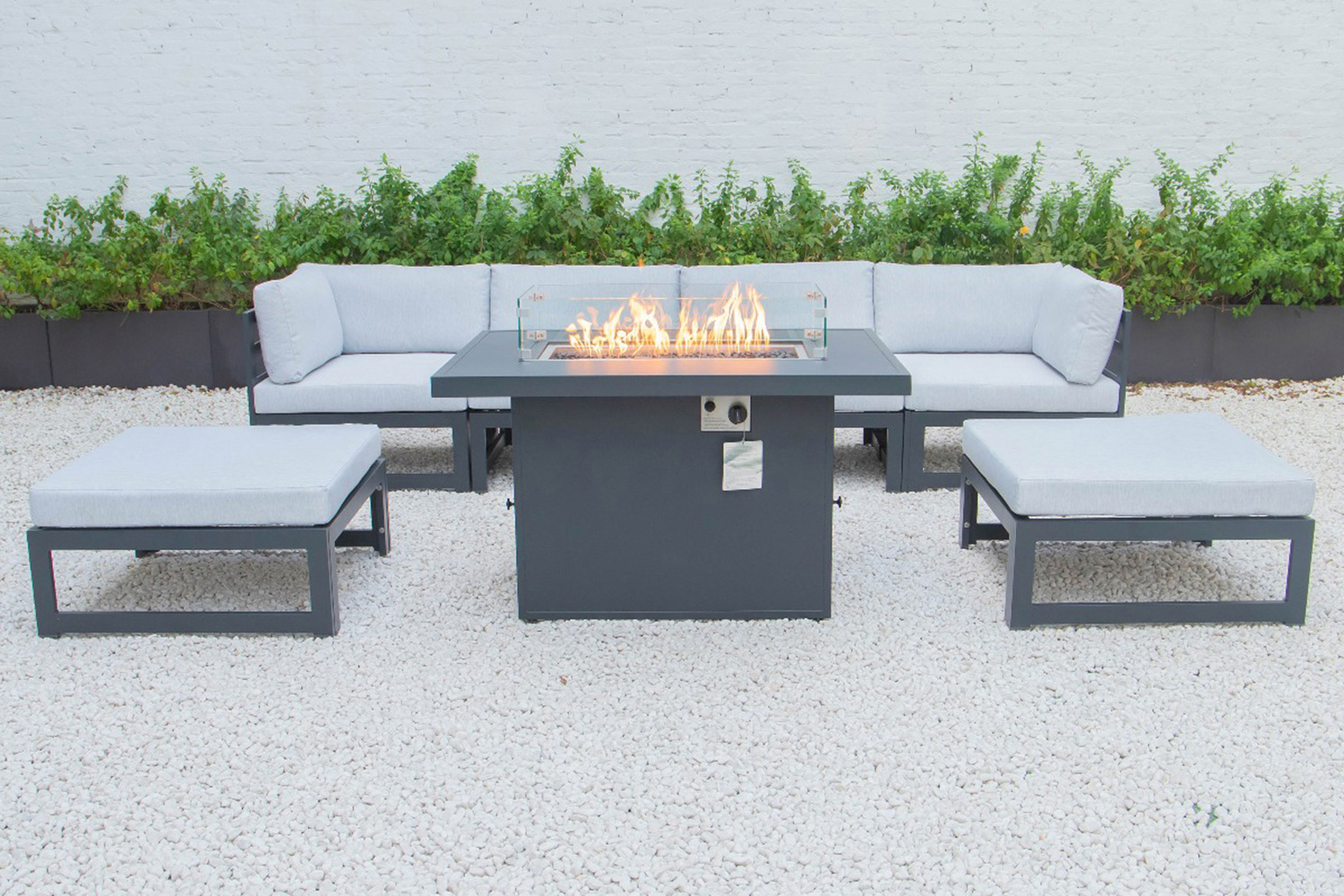 LeisureMod Chelsea 7-Piece Patio Ottoman Sectional and Fire Pit Table Black Aluminum with Cushions