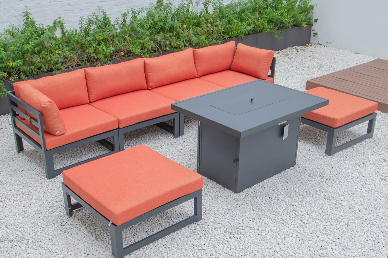 LeisureMod Chelsea 7-Piece Patio Ottoman Sectional and Fire Pit Table Black Aluminum with Cushions - Orange