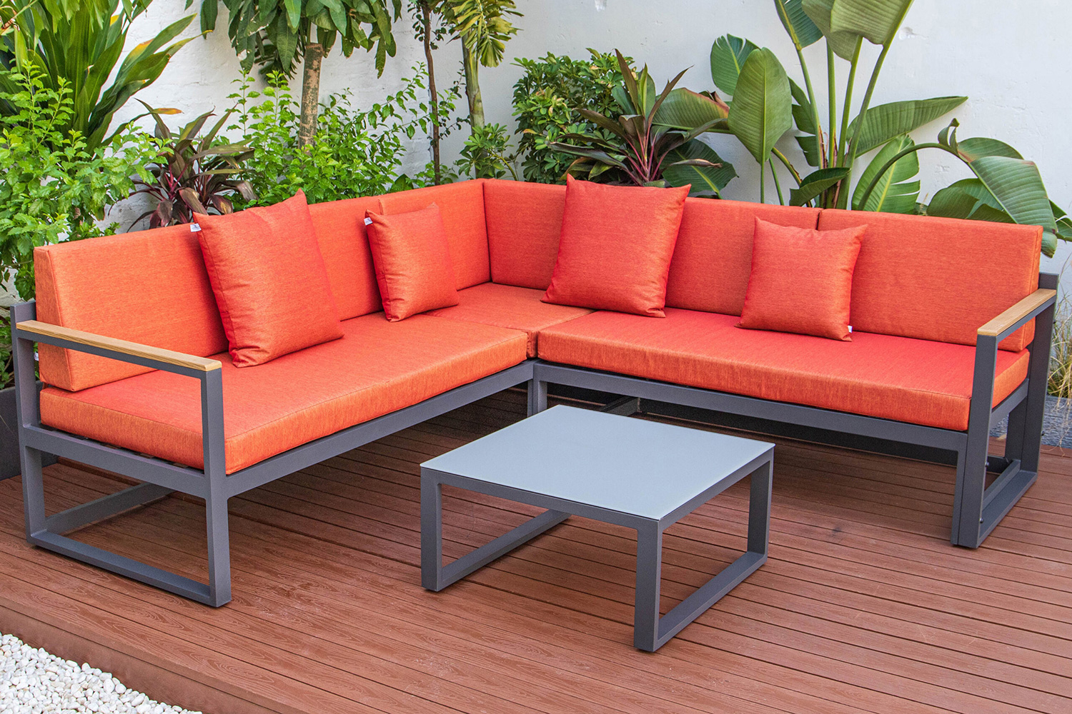 LeisureMod Chelsea Black Sectional with Adjustable Headrest and Coffee Table with Cushions - Orange