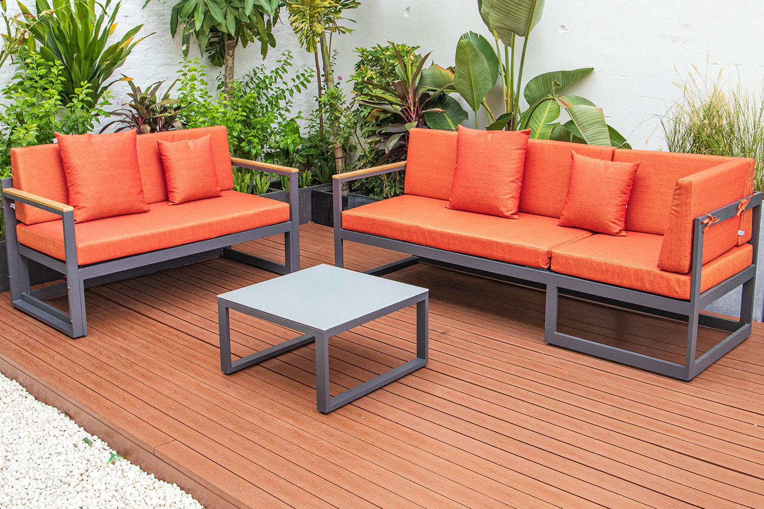 LeisureMod Chelsea Black Sectional with Adjustable Headrest and Coffee Table with Cushions - Orange