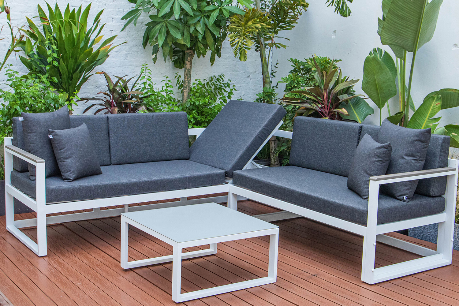 LeisureMod Chelsea White Sectional with Adjustable Headrest and Coffee Table with Cushions - Black