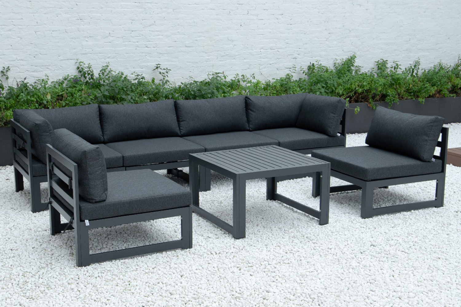 LeisureMod Chelsea 7-Piece Patio Sectional and Coffee Table Set Black Aluminum with Cushions